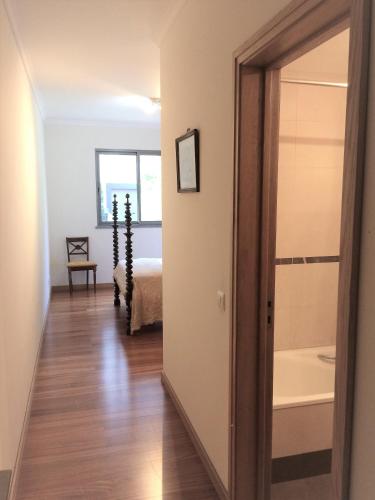 a hallway with a door leading to a bedroom at Rochas Shared Apart Garden Refuge in Funchal