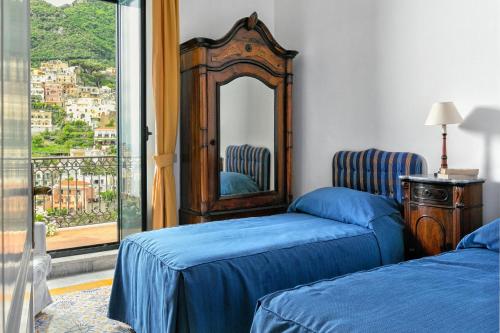 Ένα ή περισσότερα κρεβάτια σε δωμάτιο στο Palazzo Margherita