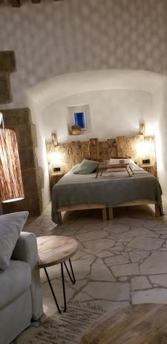 מיטה או מיטות בחדר ב-Bocage Belle Histoire