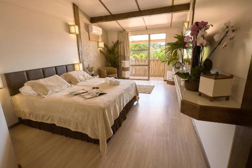 מיטה או מיטות בחדר ב-Village Praia do Rosa
