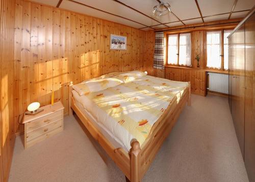 Postel nebo postele na pokoji v ubytování Chalet Heimetli