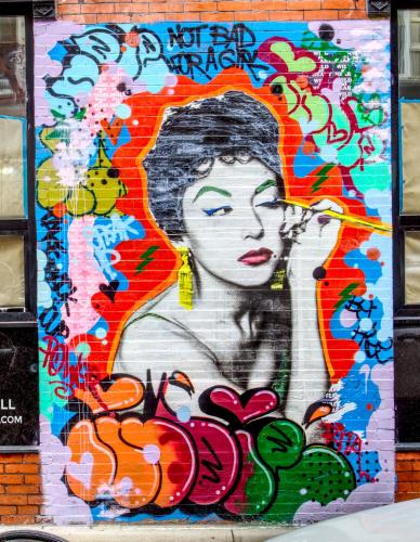 a painting of a woman on the side of a building at The Ridge in New York