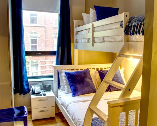 a bunk bed in a room with a window at The Ridge in New York