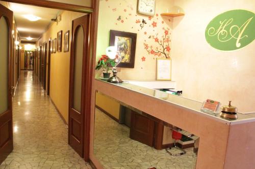 a hotel hallway with a long counter in a room at Hotel America in Milan