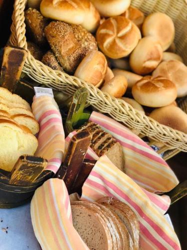 a bunch of baskets filled with different types of bread at Gasthof Rebstock in Friedrichshafen