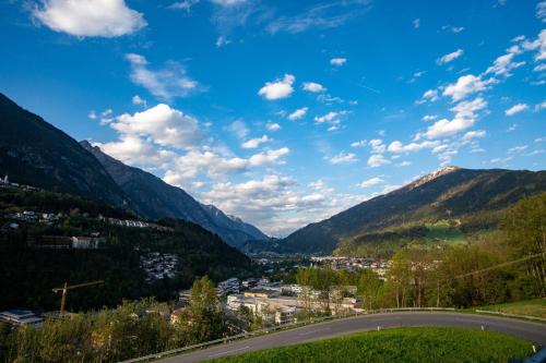 a view of a valley in the mountains with a road at Hotel Bruggner Stub`n in Landeck