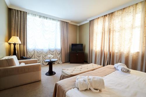 Postel nebo postele na pokoji v ubytování Smith Hotel