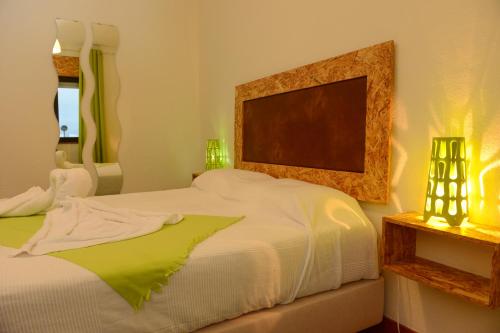 A bed or beds in a room at SEIA Apartamentos Serra da Estrela
