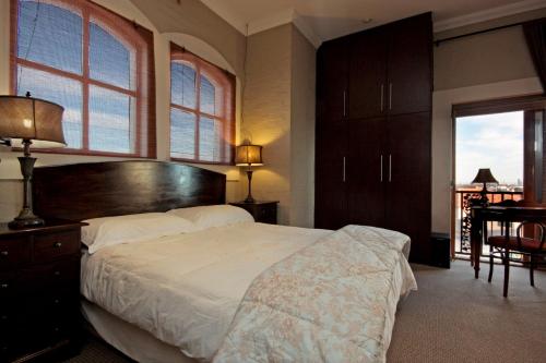 Ένα ή περισσότερα κρεβάτια σε δωμάτιο στο A Smart Stay Apartments