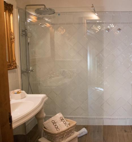 a bathroom with a shower and a sink at Hotel Abaco Altea in Altea