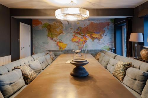 a long table in a room with a map on the wall at Ocean View,Kinsale, Hosted by Exquisite holiday homes, sleeps 22 in Kinsale