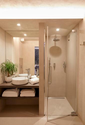 a bathroom with a sink and a shower at Locanda La Clusaz in Gignod