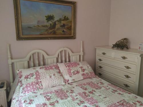 Giường trong phòng chung tại Condomínio Vila Paradiso