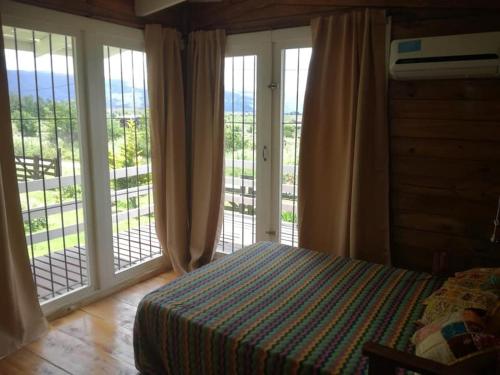 Ένα ή περισσότερα κρεβάτια σε δωμάτιο στο CABAÑAS LA GUADALUPE