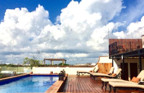 a patio with a swimming pool on a building at La Pasion Colonial Hotel Boutique By Bunik in Playa del Carmen