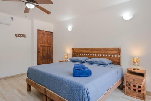 Giường trong phòng chung tại Villas Picalu Studios & Suites