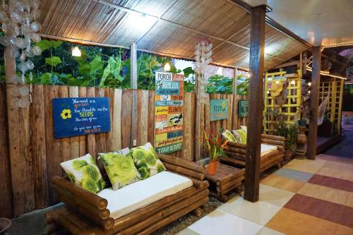 a store with two couches in front of a fence at Natura Vista in Panglao