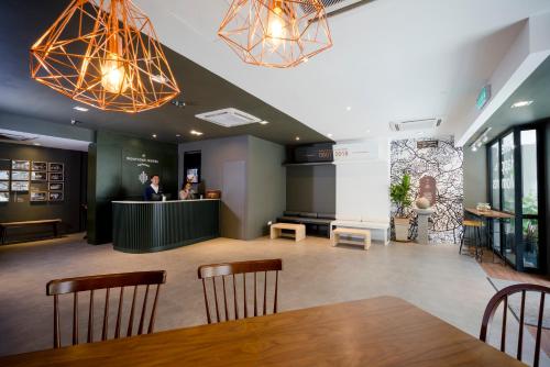 a meeting room with a table and chairs at H Boutique Hotel Xplorer Cheras in Kuala Lumpur