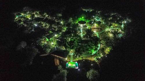 an aerial view of a park at night with lights at Evolução Ecolodge in Iranduba