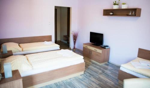 Postel nebo postele na pokoji v ubytování Penzion - Restaurace Na Mýtě