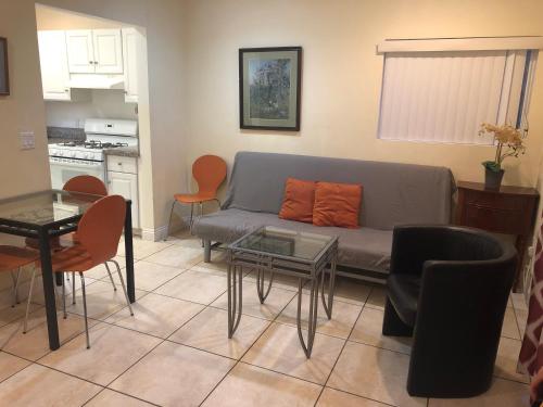 a living room with a couch and a table at Beautiful New Home in Burbank 1bd in Burbank