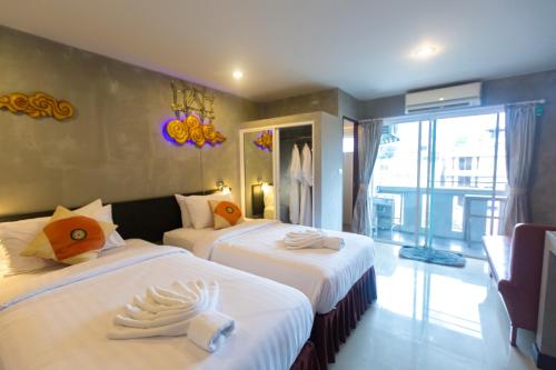Katil atau katil-katil dalam bilik di Baan Kamala Fantasea Hotel