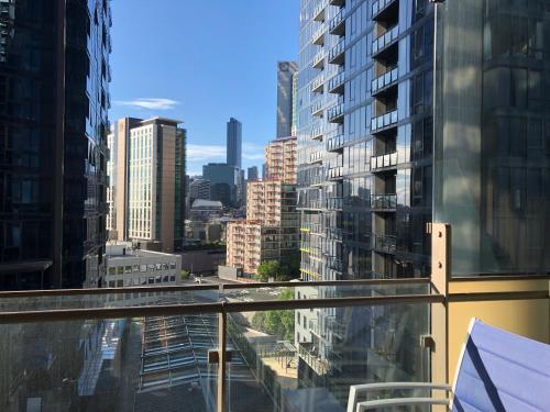 a view of a city from the balcony of a building at EPIC Private Apartment in Melbourne