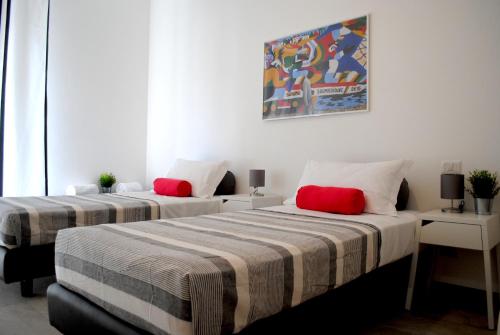 Posteľ alebo postele v izbe v ubytovaní BNBOOK - Galbiati Flat