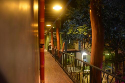 a hallway of a building at night with a street light at Royal Tusker Hotel in Udawalawe