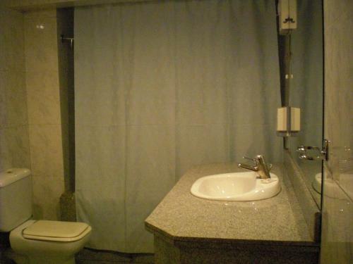 a bathroom with a sink and a toilet at Philippe Luxor Hotel in Luxor