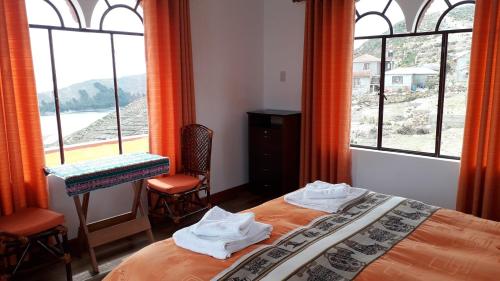 Cama o camas de una habitación en Hostal Jallalla