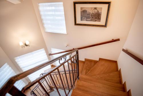a staircase in a house with a picture on the wall at Ana Boutique in Alba Iulia