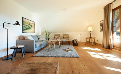 a living room with a couch and a table at Hotel & Restaurant Linde in Münstertal