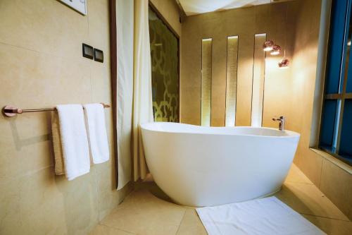Koupelna v ubytování V Boutique Hotel