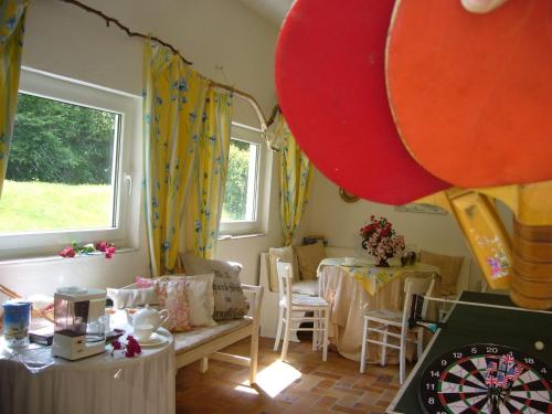 a room with a group of tables and balloons at Ferienidyll Aumühle, "Bebenburg" in Rot am See