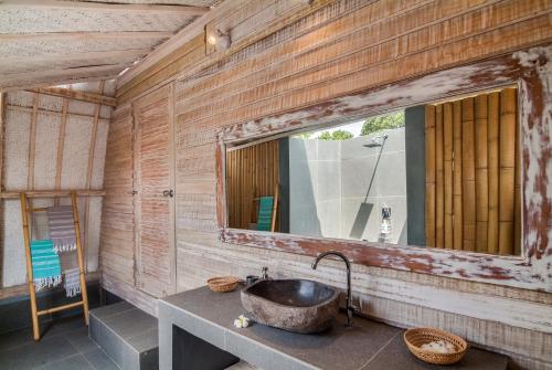 a bathroom with a sink and a mirror at Gili Air Escape - Adults Only in Gili Islands
