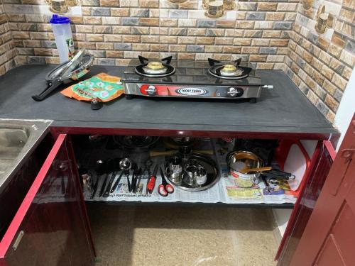 a stove top oven sitting on top of a counter at TEMPLE TREE HOMES next to SANKARA NETHRALAYA & APOLLO HOSPITALS in Chennai