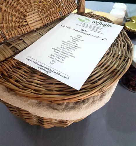 a wicker basket with a piece of paper on it at Refúgio in Horta
