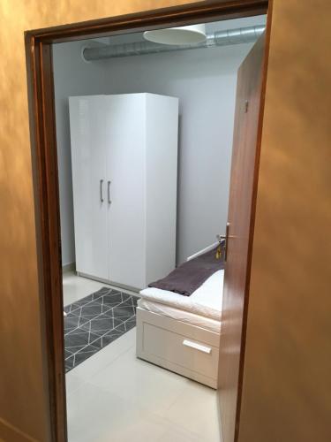 a small room with a small room with a small bed at Mia Mia House in Katowice