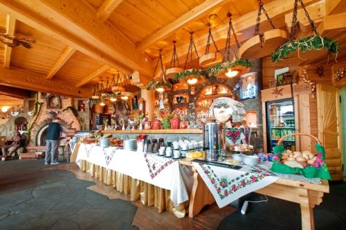 a store with several tables in a room at Skalny Dworek in Nowy Targ