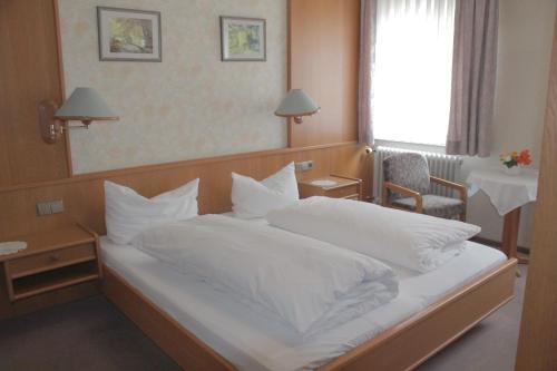 Katil atau katil-katil dalam bilik di Gasthof Rose