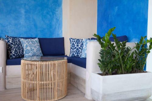a living room with a couch and a table at Enorme Serenity Spritz - Adults Only in Hersonissos