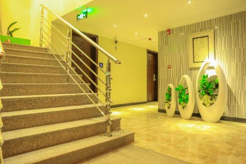 a lobby with stairs in a building at Denver boutique hotel in Addis Ababa