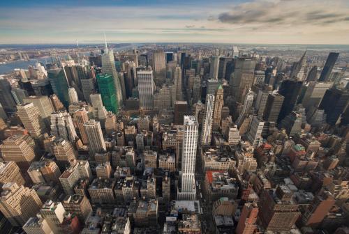 an aerial view of a large city with skyscrapers at The Langham, New York, Fifth Avenue in New York