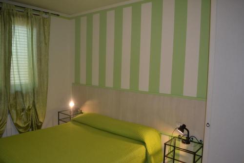 Ένα ή περισσότερα κρεβάτια σε δωμάτιο στο Il Girasole