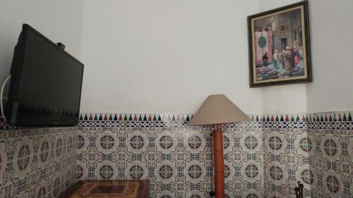 TV in/ali zabaviščno središče v nastanitvi Dar Arij