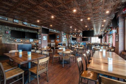 a dining room with wooden tables and chairs at Westgate Myrtle Beach Oceanfront Resort in Myrtle Beach