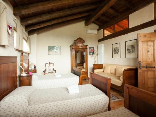 Postel nebo postele na pokoji v ubytování B&B Asolo Casapagnano