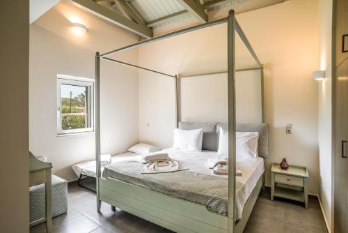 Кровать или кровати в номере Three Stars Luxury Villas