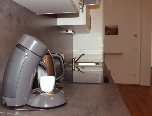 a mixer sitting on a counter in a kitchen at Albert Schweitzer Center Graz in Graz